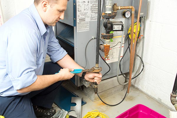 working on a gas furnace