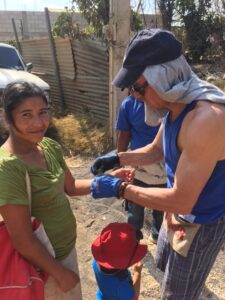 Duane sharing the gospel with a local woman.