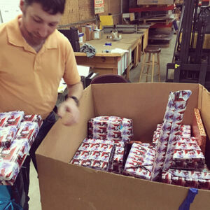 Josh Crowder Loading a Box of Presents